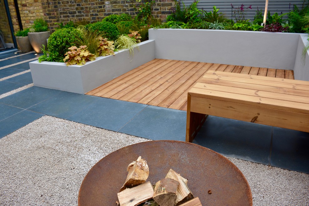 Inspiration for a small contemporary back partial sun garden in London.