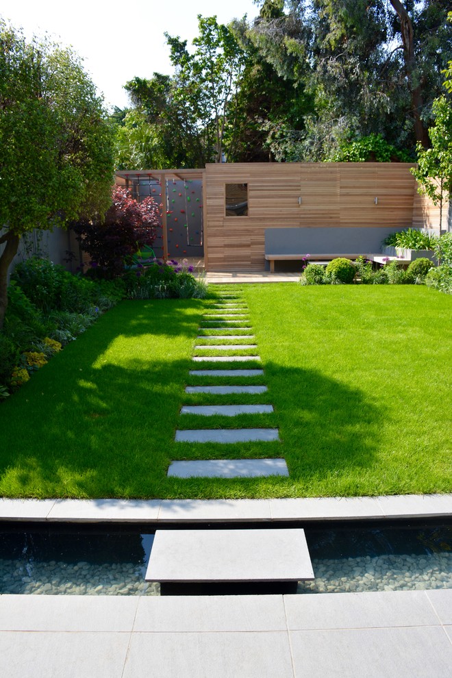 Inspiration for a medium sized contemporary back full sun garden in London with decking.