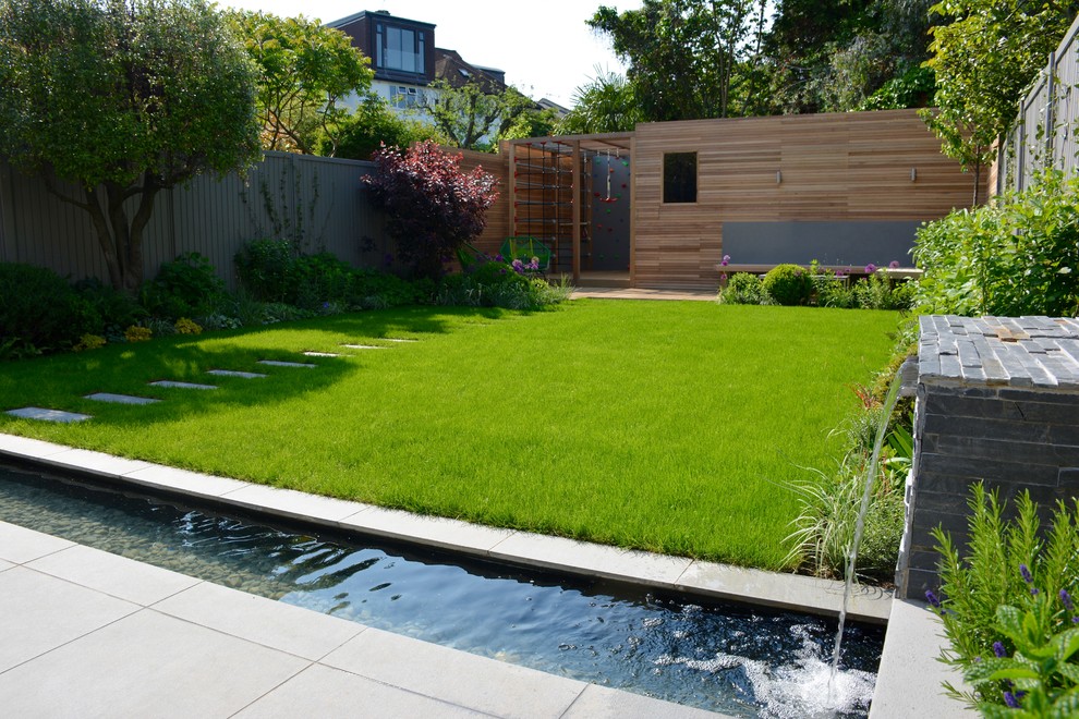 Medium sized contemporary back full sun garden in London with decking.