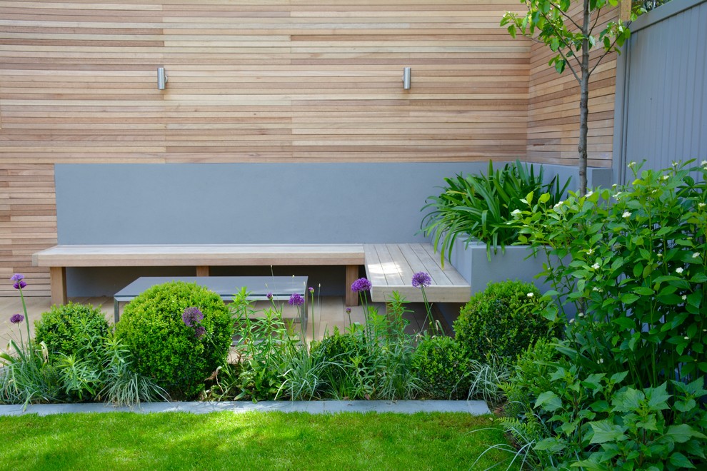 Inspiration for a medium sized contemporary back full sun garden in London with decking.