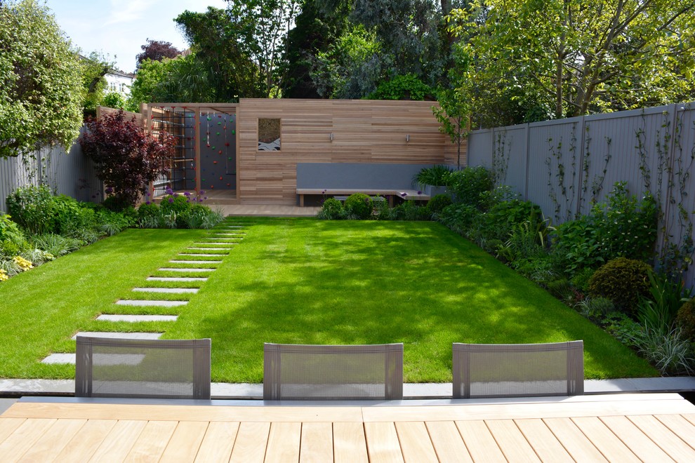 Photo of a medium sized contemporary back full sun garden in London with decking.