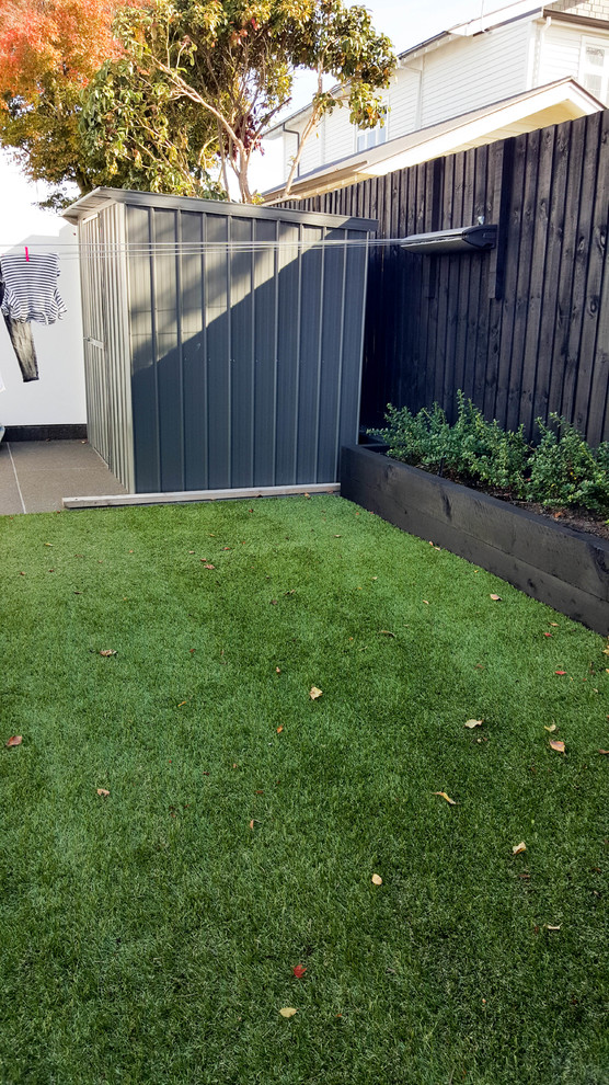 Medium sized contemporary back garden in Christchurch.