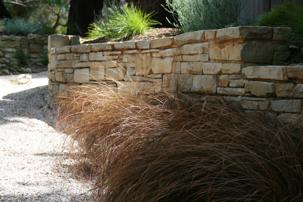 Photo of a large coastal drought-tolerant and shade front yard landscaping in Geelong with decking.