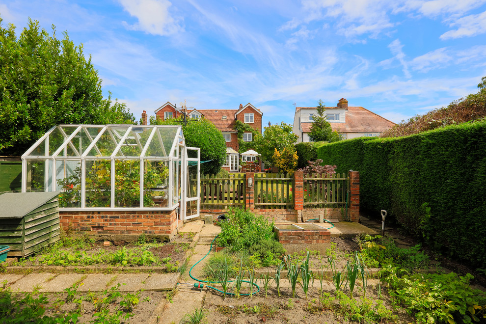 Inspiration for a traditional landscaping in Sussex.