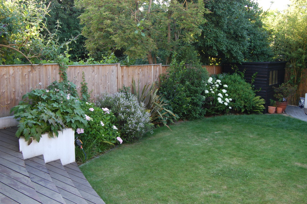 Photo of a medium sized contemporary back garden for summer in London with decking.