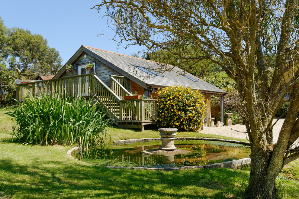 Inspiration for a traditional garden in Other with a water feature.