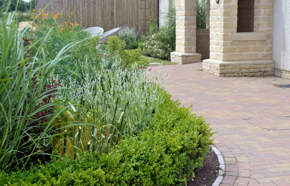 Design ideas for a large classic back garden in Gloucestershire with decorative stones.
