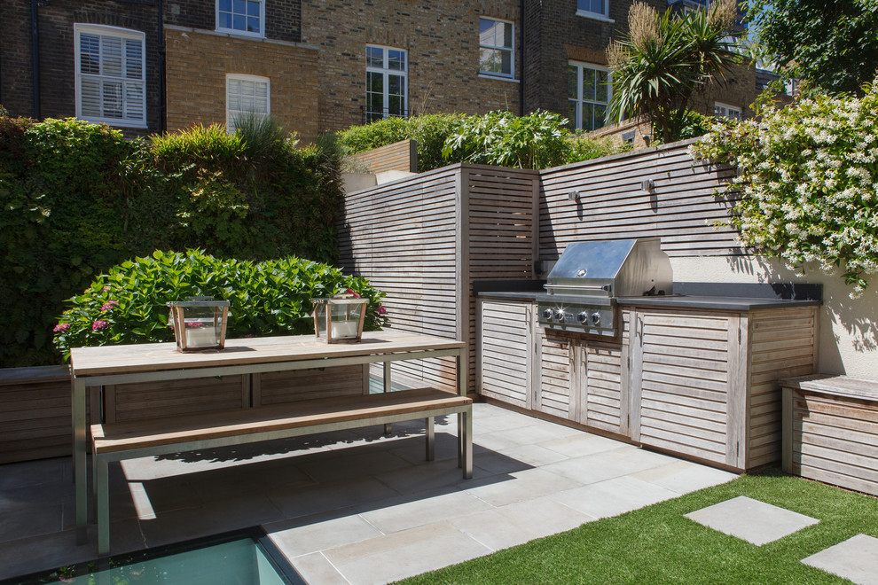 Design ideas for a small contemporary courtyard full sun garden for summer in London.