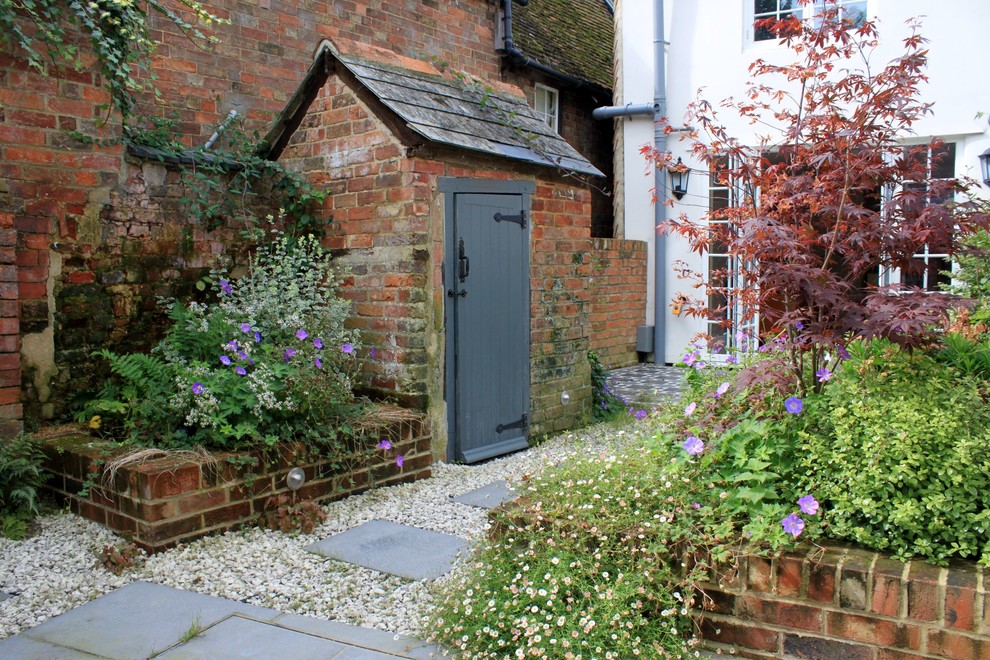 This is an example of a small victorian back partial sun garden in London.