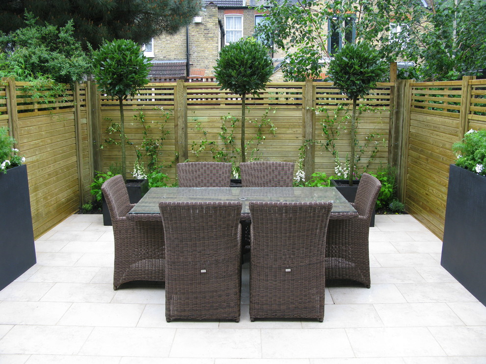 Photo of a small contemporary back full sun garden for summer in London.