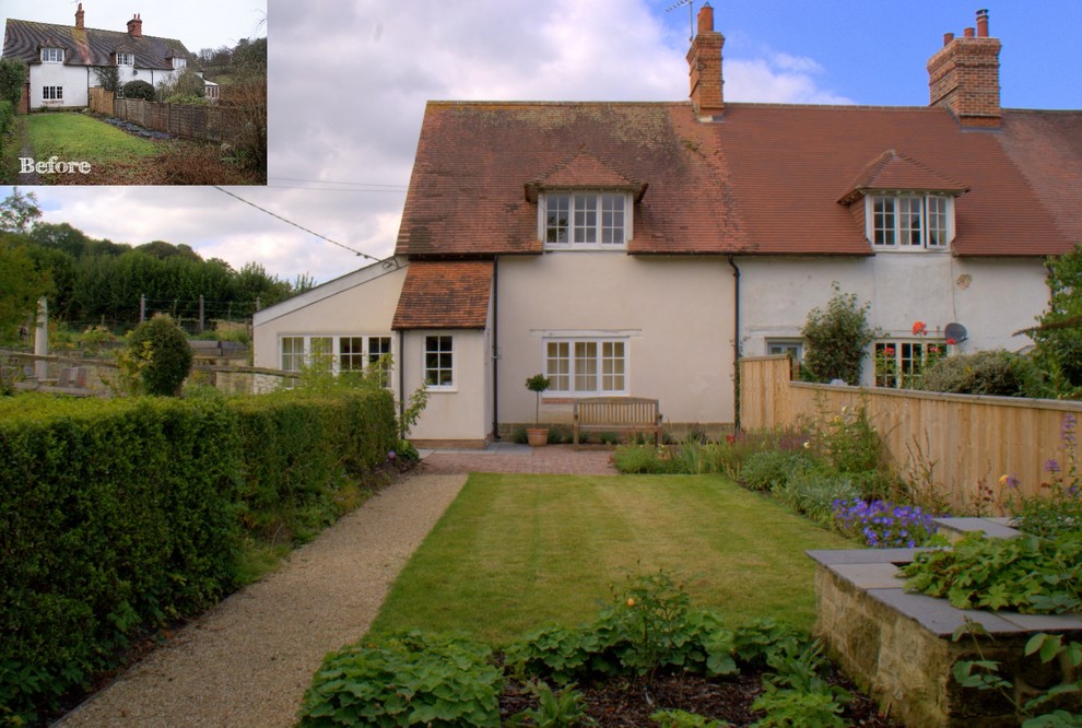 Country front formal full sun garden in Wiltshire with a garden path and brick paving.