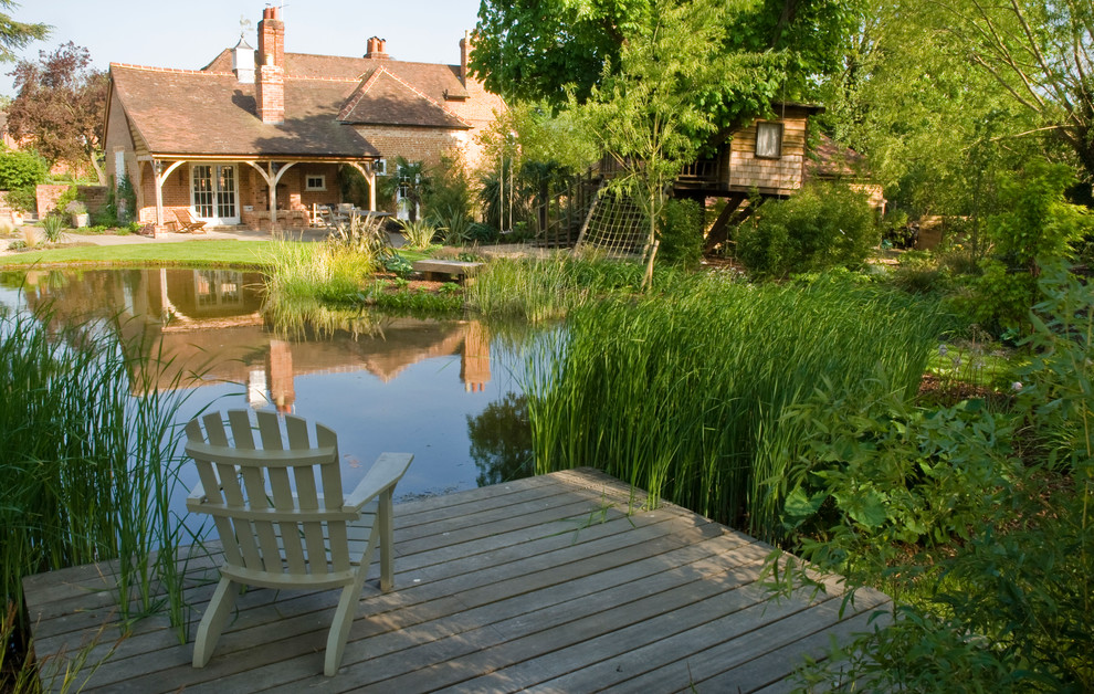 Inspiration for a large rustic back partial sun garden for summer in Sussex with a water feature and decking.