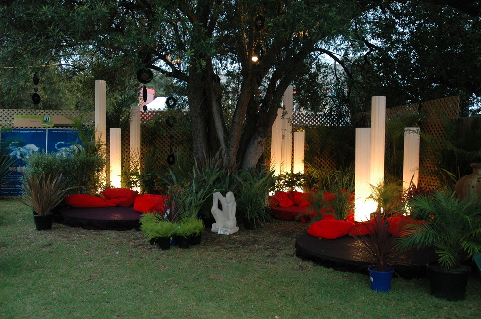 Photo of a mid-sized eclectic partial sun backyard landscaping in Adelaide.