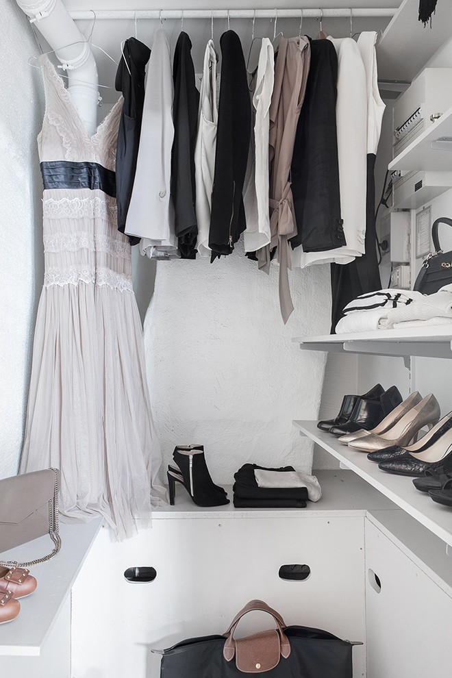 Medium sized contemporary gender neutral standard wardrobe in Gothenburg with open cabinets.