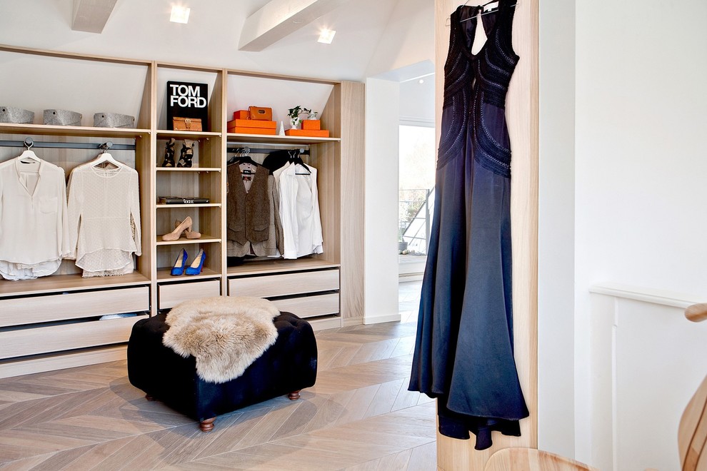 Inspiration for a large contemporary walk-in wardrobe for women in Malmo.