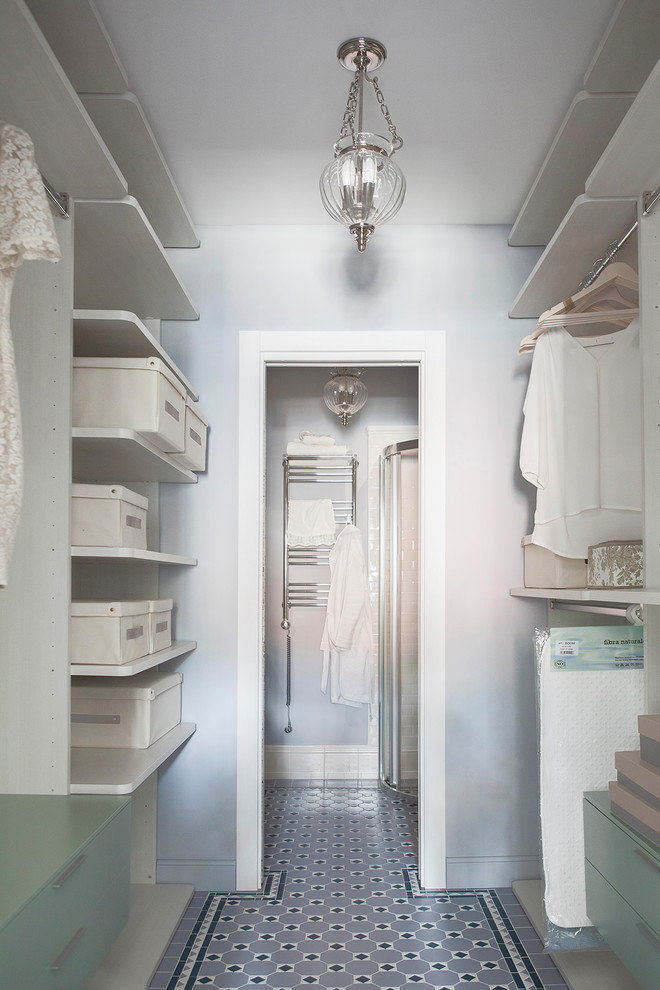 Inspiration for a small classic walk-in wardrobe for women in Moscow with open cabinets, ceramic flooring, multi-coloured floors and beige cabinets.
