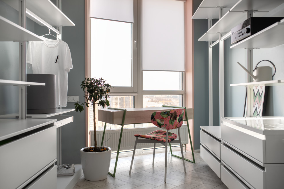Idéer för ett mellanstort modernt omklädningsrum för könsneutrala, med betonggolv, vitt golv, släta luckor och vita skåp