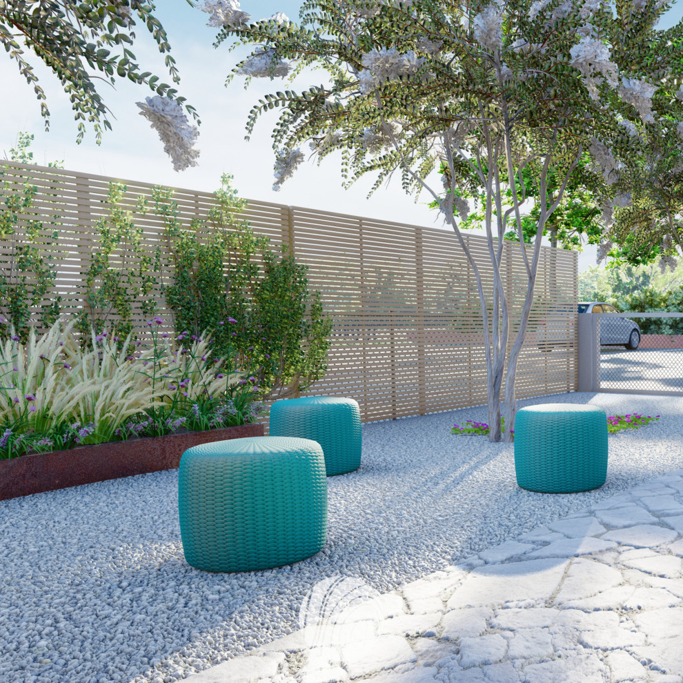 Foto di un piccolo giardino design esposto in pieno sole davanti casa con ghiaia