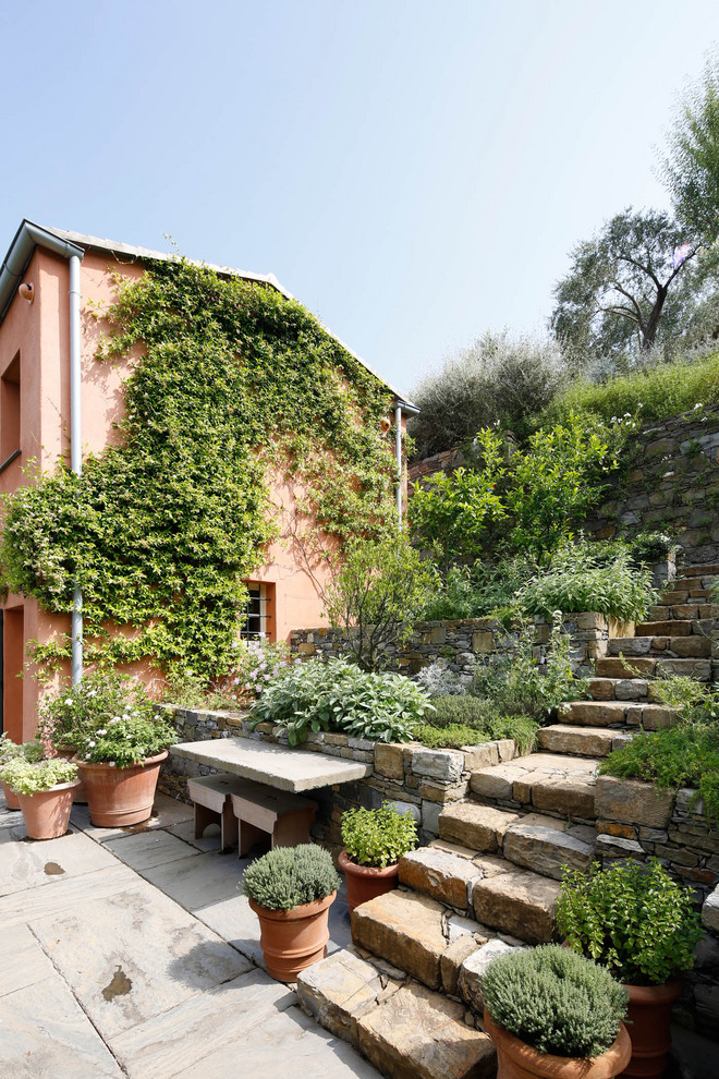 Photo of a farmhouse side garden in Milan with a potted garden.