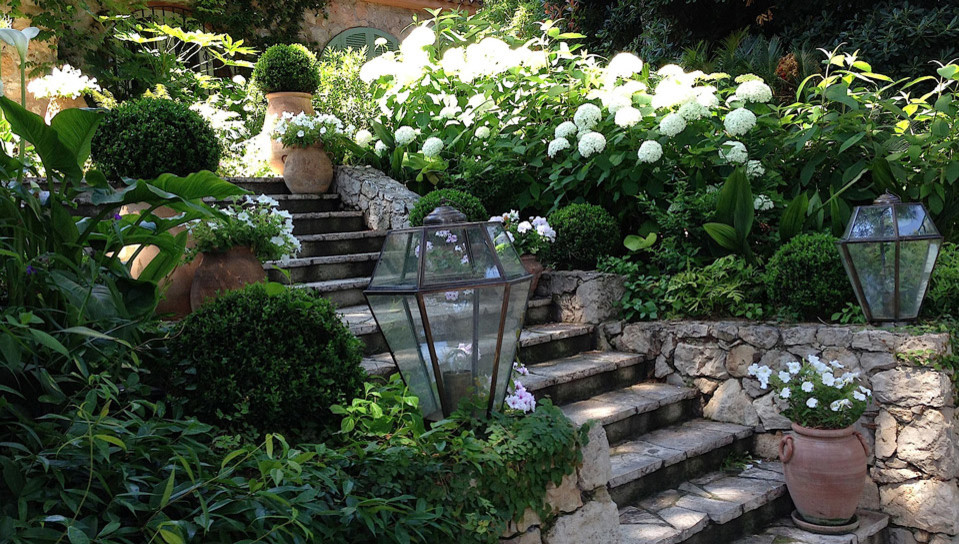 This is an example of a mid-sized mediterranean partial sun stone garden path in Milan for summer.