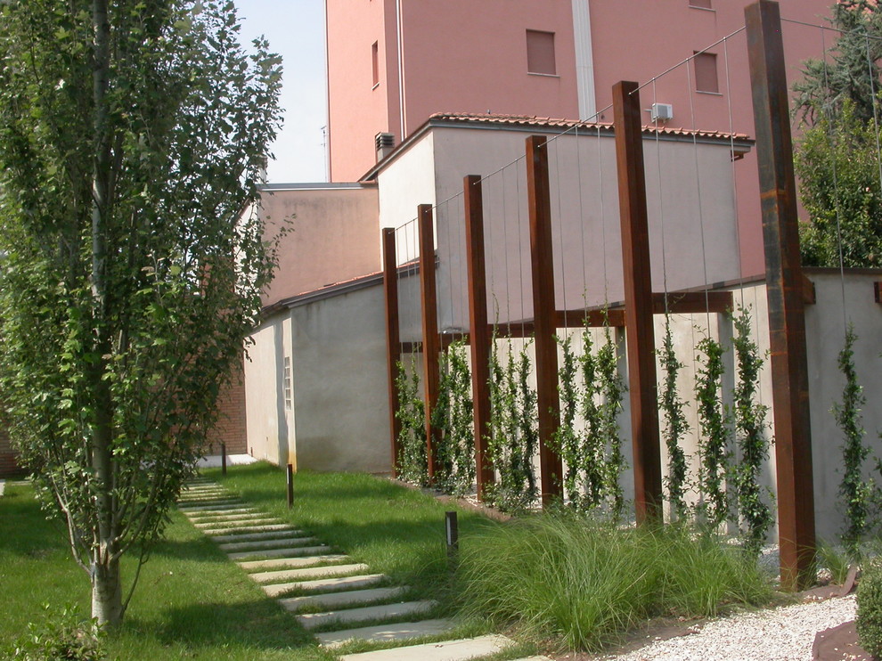 Photo of a small contemporary front yard landscaping in Bologna.