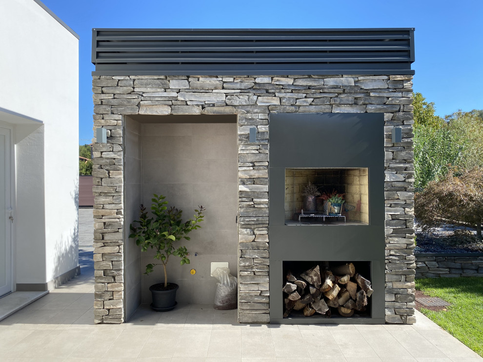 Idee per un giardino minimal esposto in pieno sole di medie dimensioni e in cortile in autunno con pavimentazioni in cemento