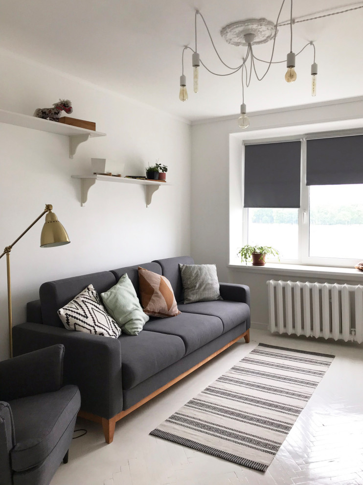 This is an example of a medium sized scandi living room in Saint Petersburg with white walls and white floors.