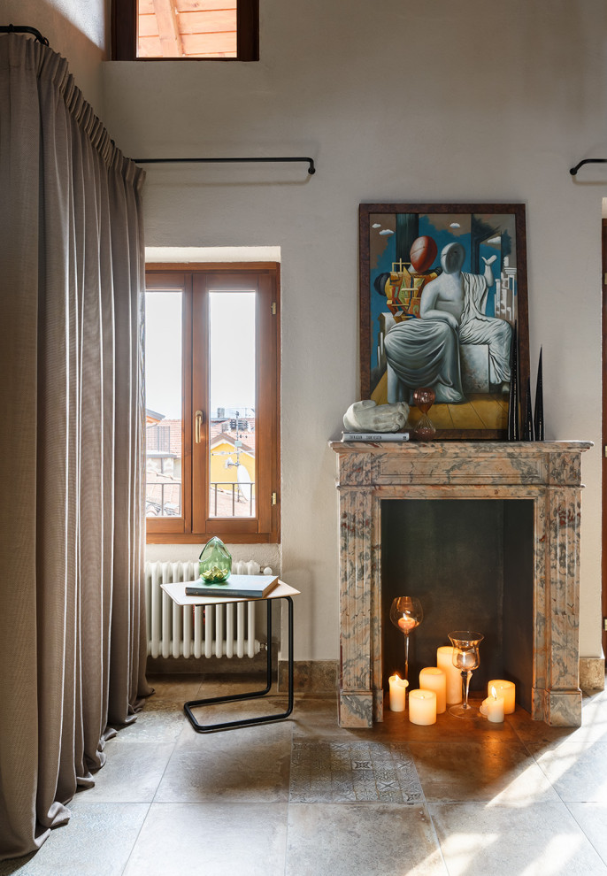 Small mediterranean mezzanine living room in Milan with porcelain flooring, a standard fireplace and a wall mounted tv.