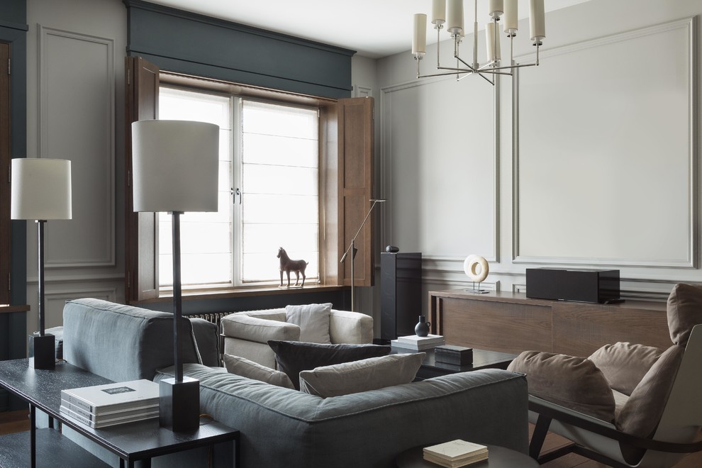 Пример оригинального дизайна: объединенная гостиная комната:: освещение в современном стиле с серыми стенами