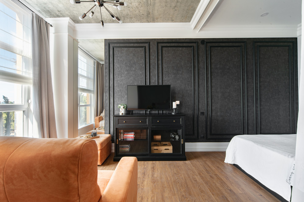 Esempio di un piccolo soggiorno bohémian aperto con pareti nere, pavimento in vinile e TV autoportante