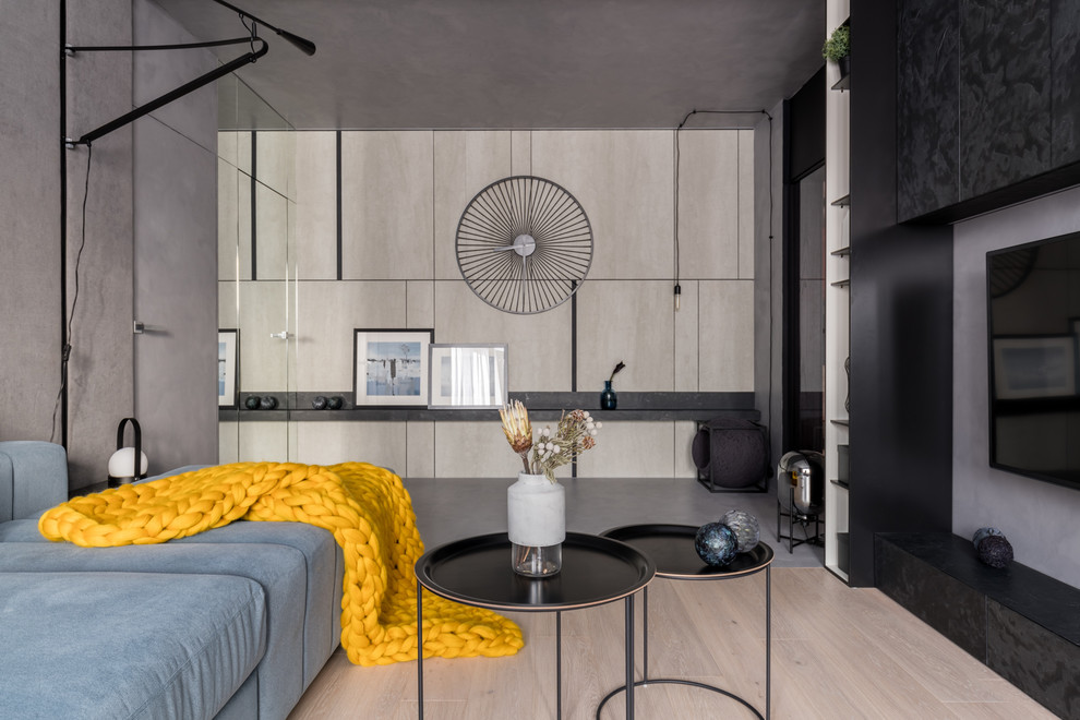 Foto di un piccolo soggiorno minimal con parquet chiaro e pavimento beige