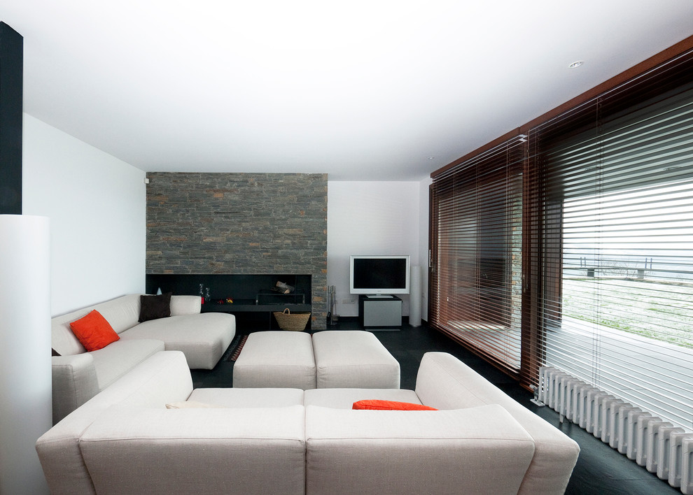 Example of a large trendy open concept slate floor living room library design in Other with white walls, a ribbon fireplace and a stone fireplace