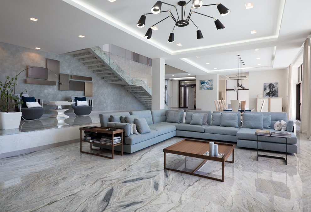 Immagine di un soggiorno minimal con pareti grigie e pavimento grigio