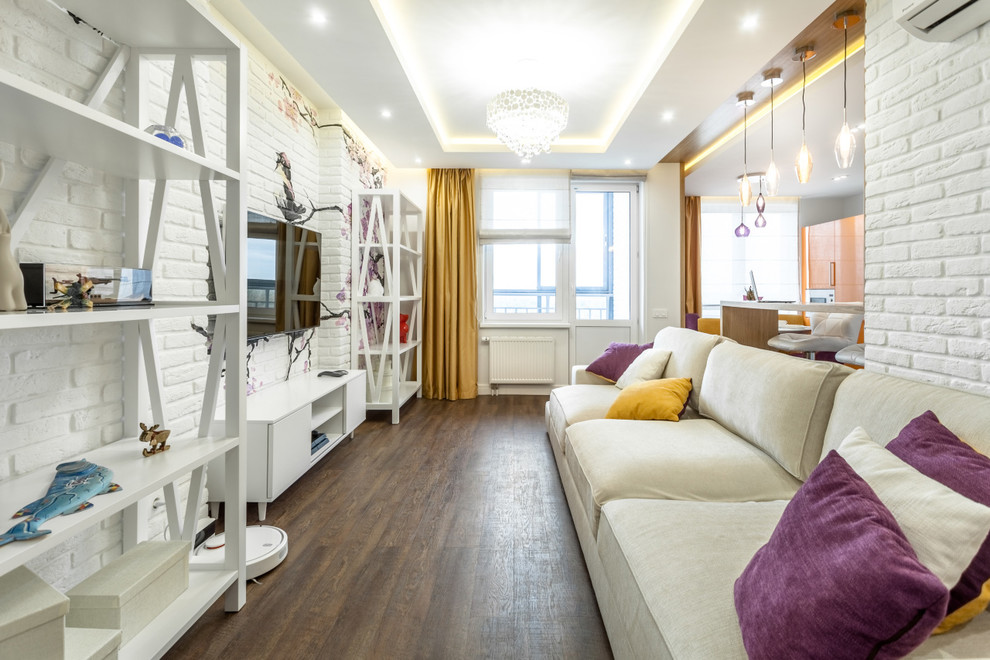 Medium sized eclectic open plan living room in Yekaterinburg with white walls, vinyl flooring, a wall mounted tv and brown floors.