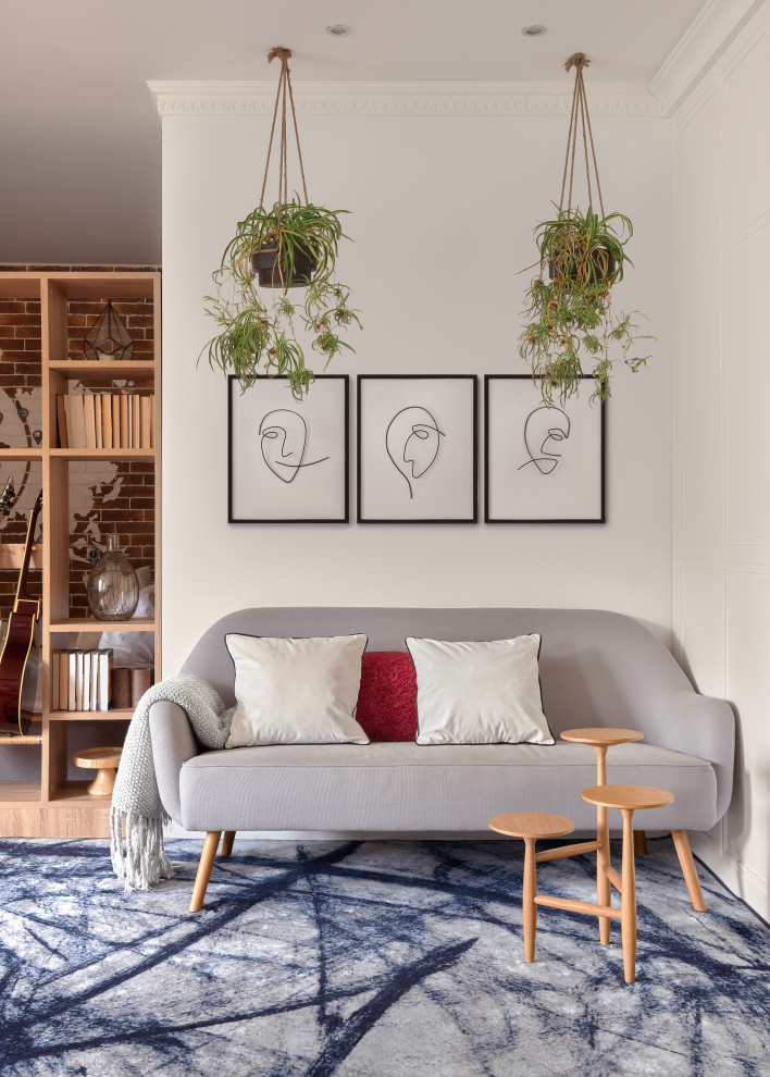 Идея дизайна: гостиная комната в скандинавском стиле с белыми стенами, ковровым покрытием и синим полом