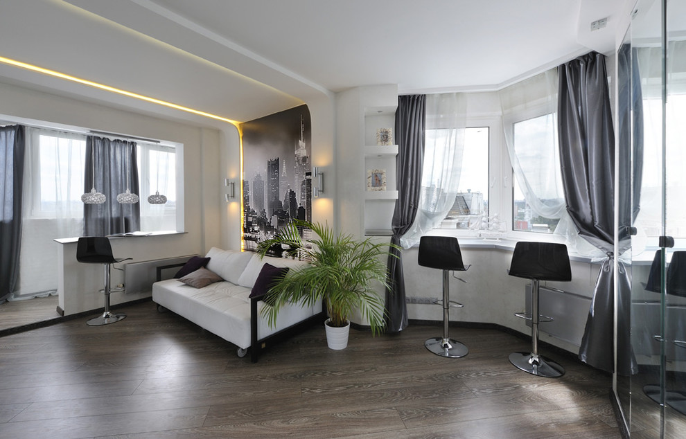 Foto di un piccolo soggiorno design chiuso con pareti bianche e parquet scuro