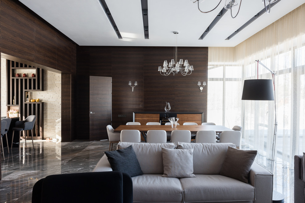 Источник вдохновения для домашнего уюта: большая открытая гостиная комната в скандинавском стиле с коричневыми стенами, мраморным полом и серым полом
