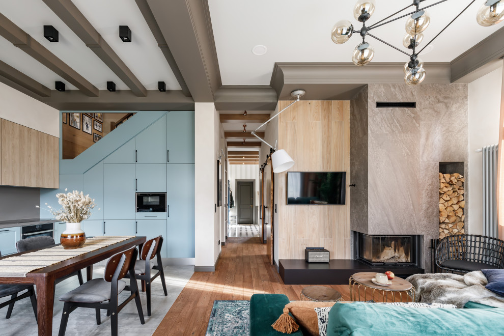 Danish formal and open concept brown floor and exposed beam living room photo in Saint Petersburg with beige walls, a corner fireplace and a wall-mounted tv