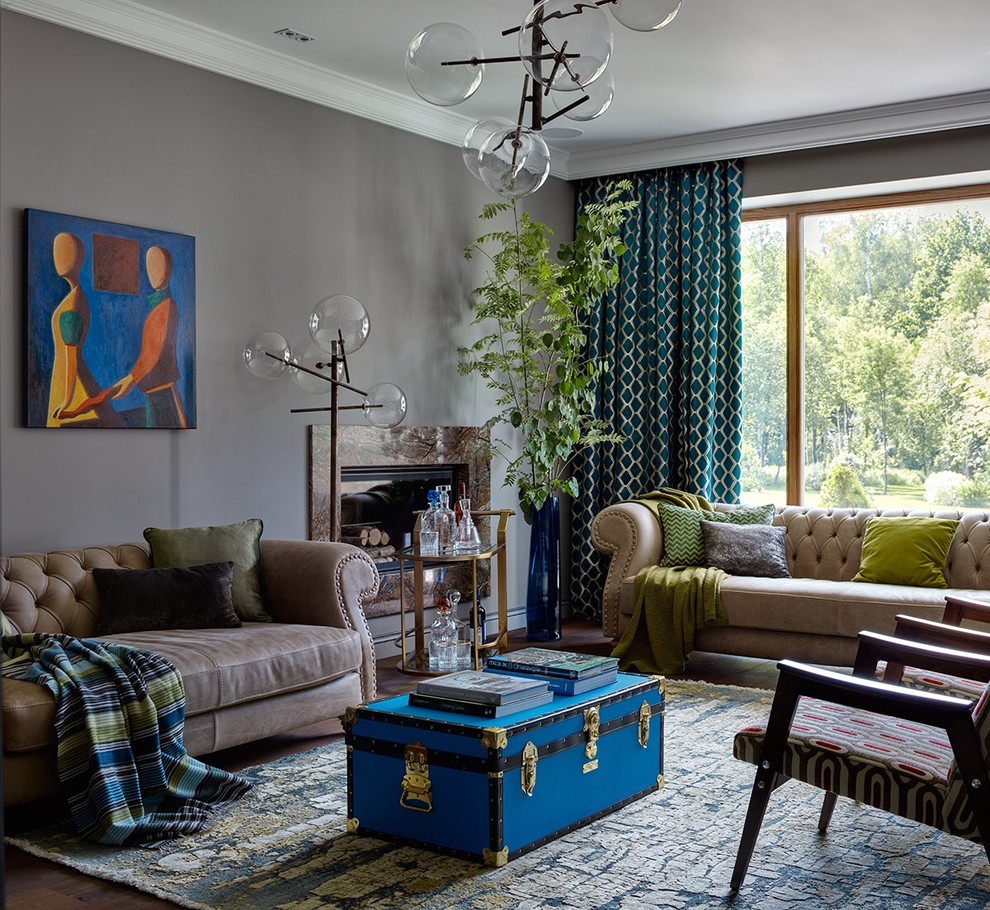 Inspiration for an eclectic open concept living room remodel in Moscow with a bar, gray walls, a standard fireplace, a metal fireplace and no tv
