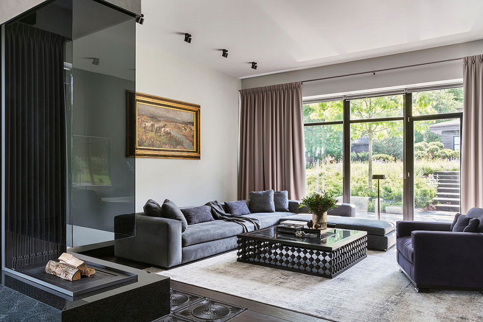Esempio di un grande soggiorno design aperto con sala formale, pareti bianche, parquet scuro, nessuna TV e pavimento marrone