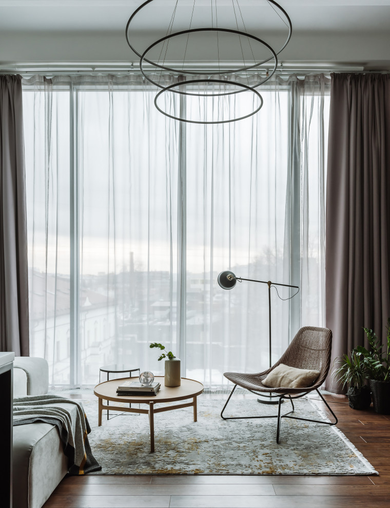 Example of a trendy open concept dark wood floor and brown floor living room design in Moscow