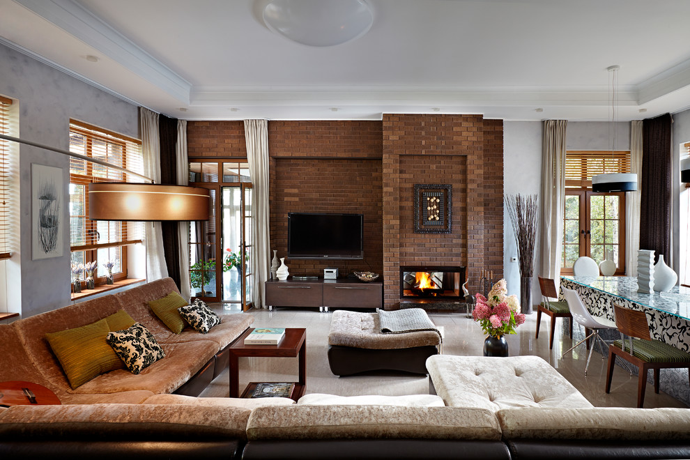 Large classic formal open plan living room in Moscow with porcelain flooring, a two-sided fireplace, a wall mounted tv, a brick fireplace surround and brown walls.