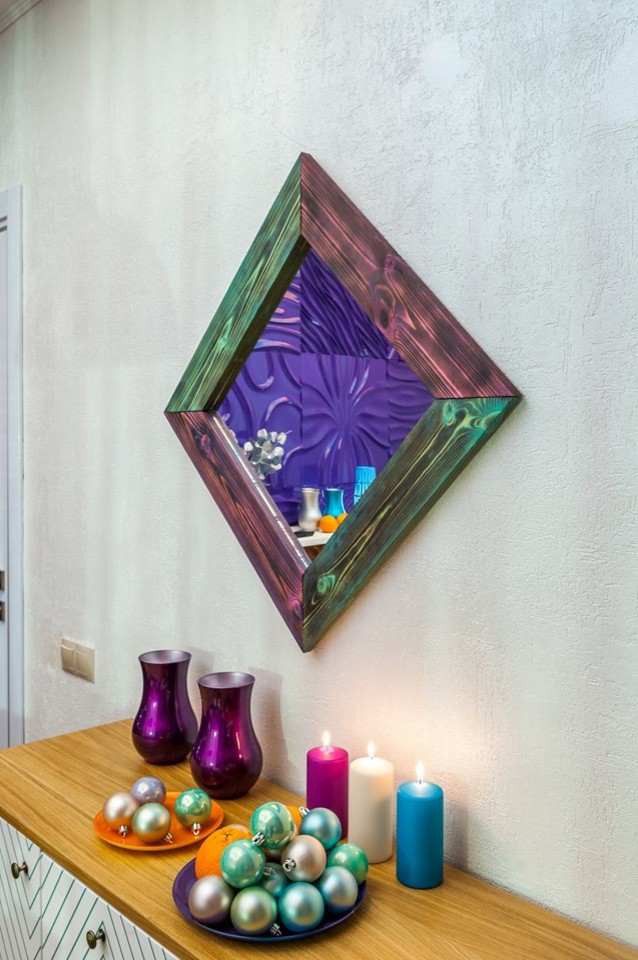На фото: гостиная комната в стиле модернизм с фиолетовыми стенами и фасадом камина из дерева с
