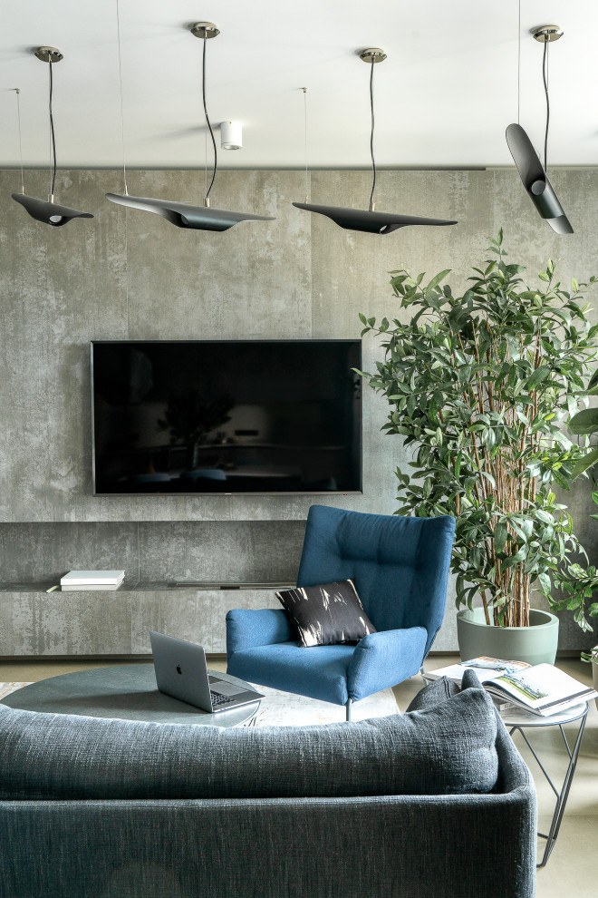 Immagine di un soggiorno design con TV a parete