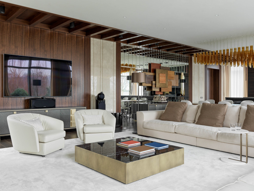 Идея дизайна: парадная, открытая гостиная комната в современном стиле с коричневыми стенами, ковровым покрытием и телевизором на стене
