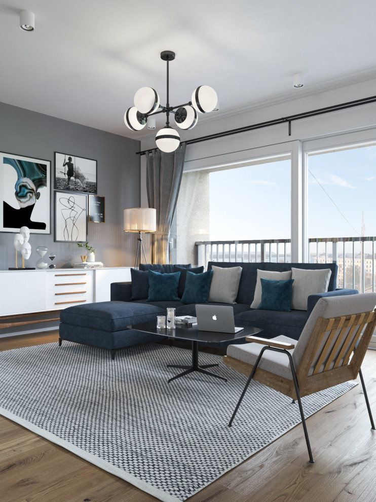 Immagine di un soggiorno scandinavo aperto e di medie dimensioni con pareti bianche, TV a parete, pavimento in legno massello medio e pavimento marrone