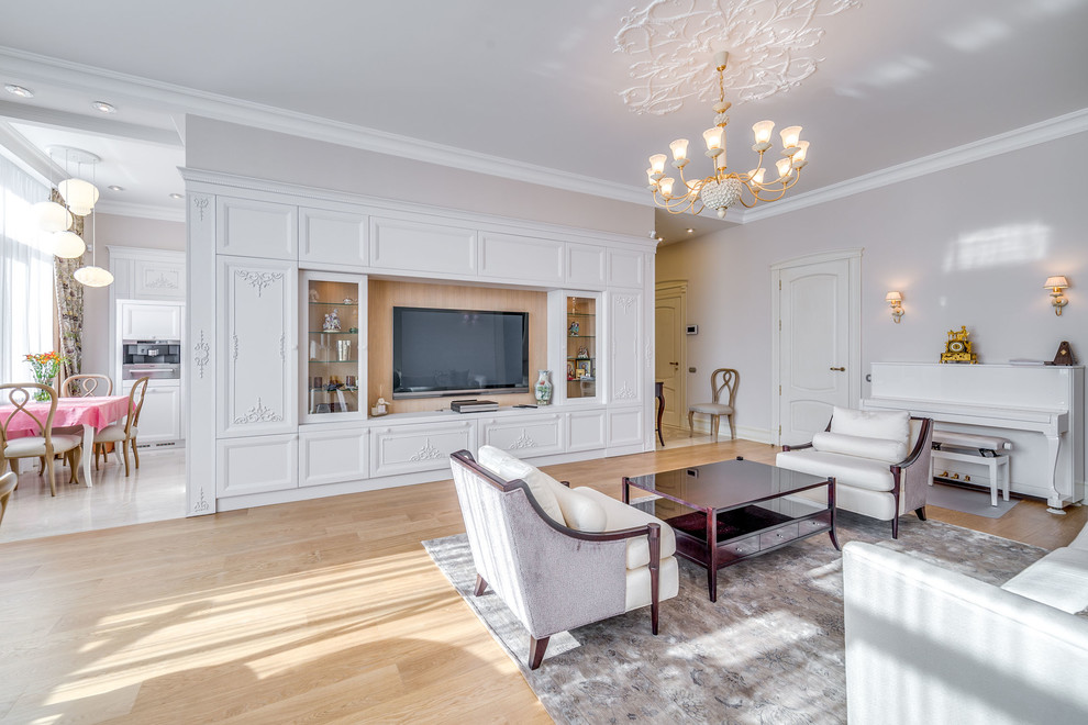 This is an example of a large traditional open plan living room in Saint Petersburg with a music area, pink walls, medium hardwood flooring, no fireplace and a wall mounted tv.