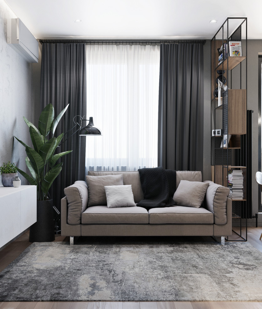 Foto di un piccolo soggiorno contemporaneo aperto con pareti grigie, pavimento in laminato e TV a parete