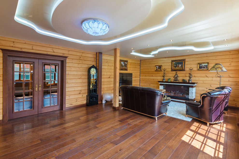Medium sized traditional formal enclosed living room in Moscow with beige walls, dark hardwood flooring, a ribbon fireplace, a wooden fireplace surround and a freestanding tv.
