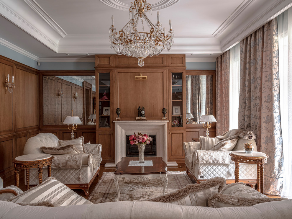 Foto di un soggiorno classico con sala formale, camino classico, soffitto ribassato e pannellatura